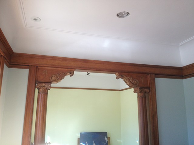Completed re-creation of swan neck plaster cove and detail, newly plastered ceiling with all refinished trim installed