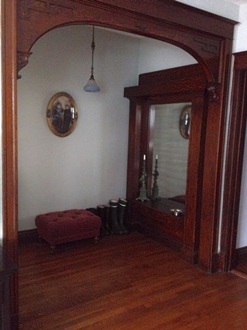 circa 1906 restored entry foyer, arch and pier with original pendant light 
