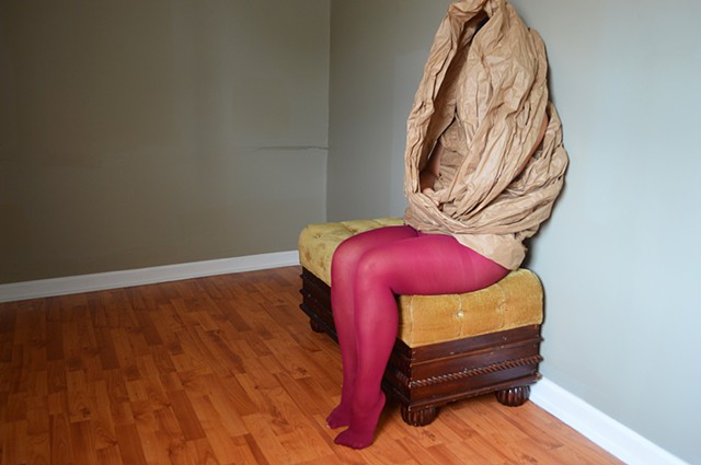 photograph of woman red tights brown paper studio by Robyn LeRoy-Evans