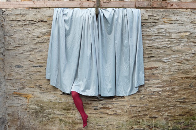 photograph of leg stockings curtains surreal drapery stone building Wales by Robyn LeRoy-Evans