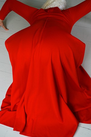 photograph of woman red dress white floorboards by Robyn LeRoy-Evans