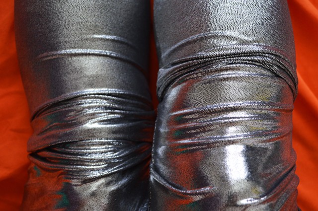 photograph of woman knees silver leggings crease folds by Robyn LeRoy-Evans