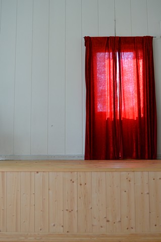photograph of red curtains white room pine stage by Robyn LeRoy-Evans