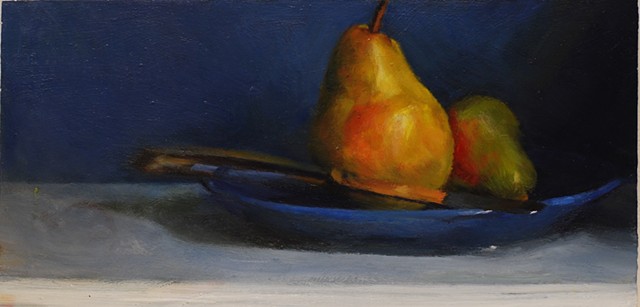 Pears and a blue plate