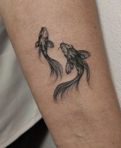 fish tattoo in black and grey Strange World Tattoo Calgary Canada