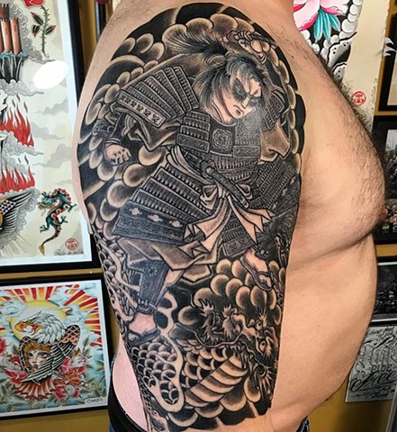 Japanese half sleeve tattoo in black and grey strange World Tattoo Calgary Alberta Canada 