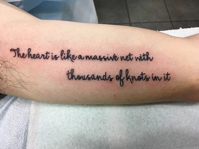 black script on the inside arm by Kristin of Strange World Tattoo in Calgary