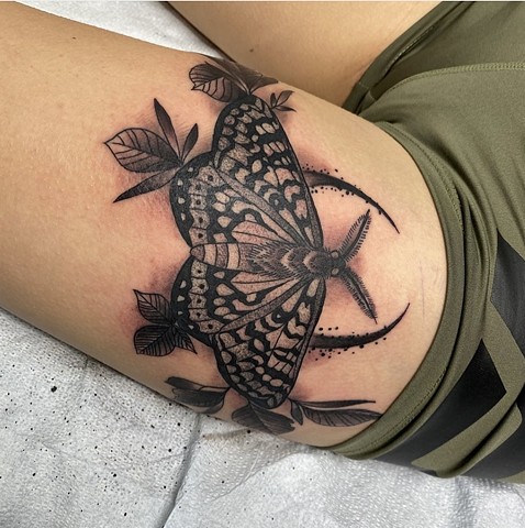 Moth tattoo black and grey tattoo strange world tattoo Calgary 