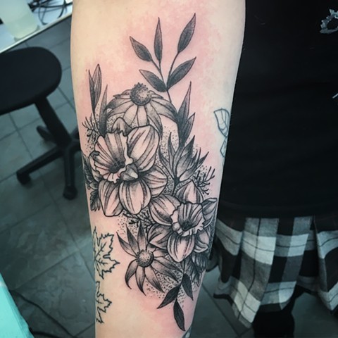 black and grey flower tattoo at Strange World Tattoo in Calgary, Alberta