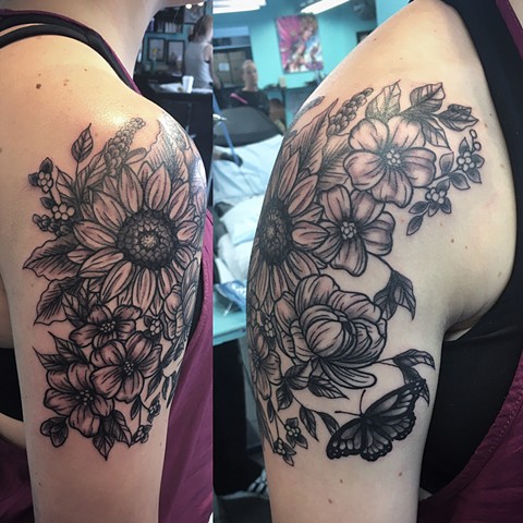 black and grey flower tattoo at Strange World Tattoo in Calgary, Alberta