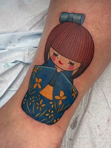 Cover up tattoo Kokeshi doll strange world tattoo Calgary Alberta 