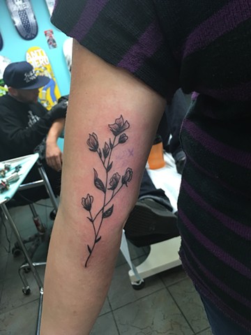 black and grey flower tattoo at Strange World Tattoo