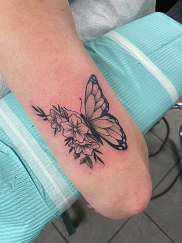 Butterfly with half floral wings