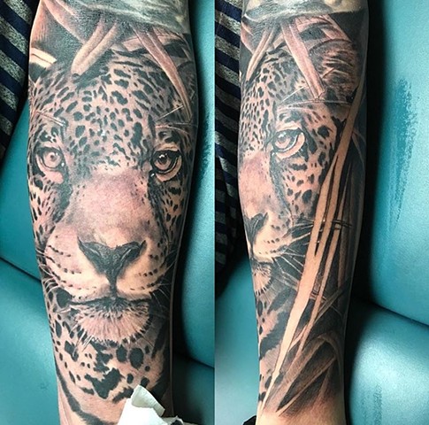 Leopard tattoo in black and grey Strange World Tattoo Calgary wild cats 