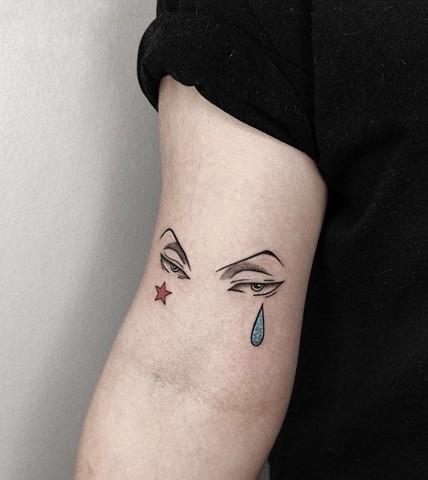 eye tattoo with star and tear Strange World Tattoo Calgary Alberta Canada