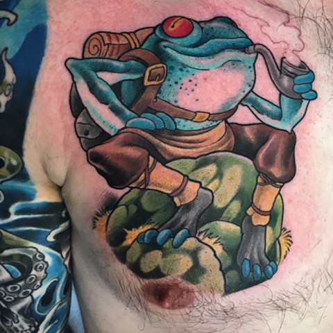 colour tattoo of frog with backpack smoking a pipe by tattoo artist Brett Schwindt of Strange World Tattoo in Calgary