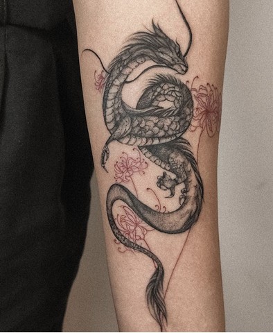 dragon tattoo on arm Strange World Tattoo in Calgary, Alberta, Canada