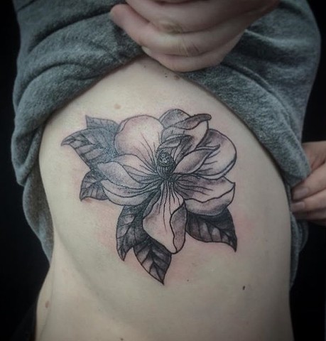 black and grey flower tattoo at Strange World Tattoo in Calgary, Alberta