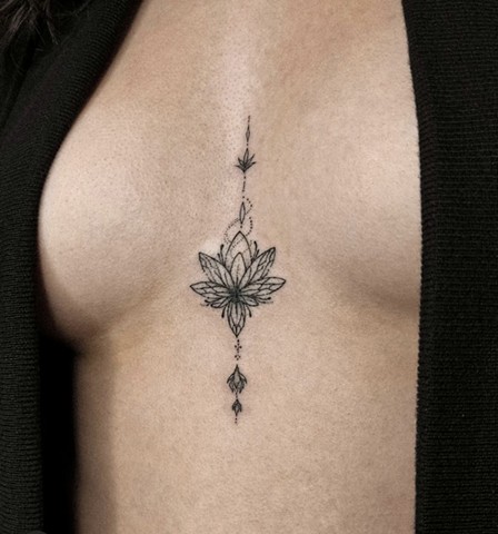 lotus flower sternum tattoo Strange World Tattoo Calgary tattoos 