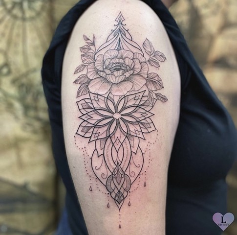 Florals and mandalas on upper arm