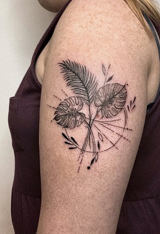 plant tattoo in black and grey Strange World Tattoo Calgary Alberta 