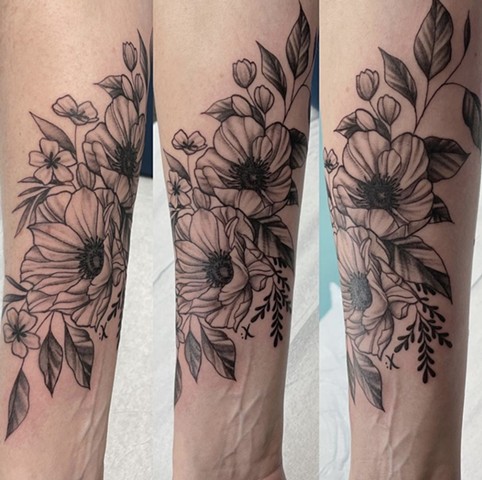 flowers in black and grey Strange World Tattoo Calgary, Alberta Canada