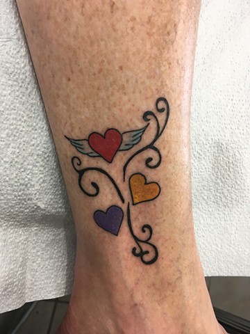 hearts and swirls tattoo