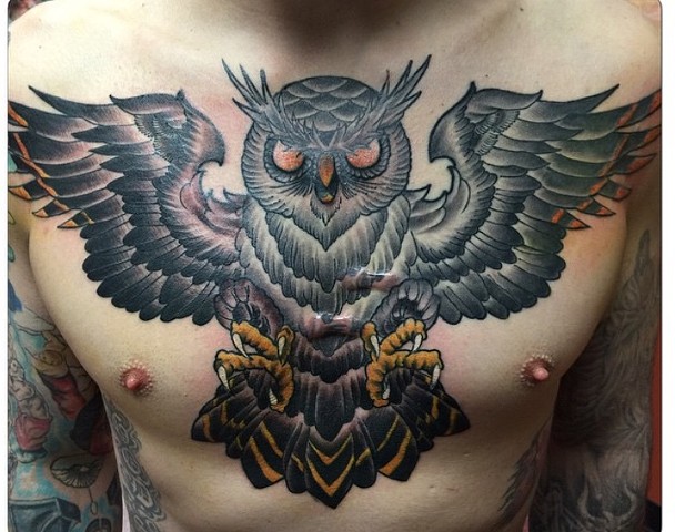 Chest owl traditonal style Strange World Tattoo Calgary, Alberta 