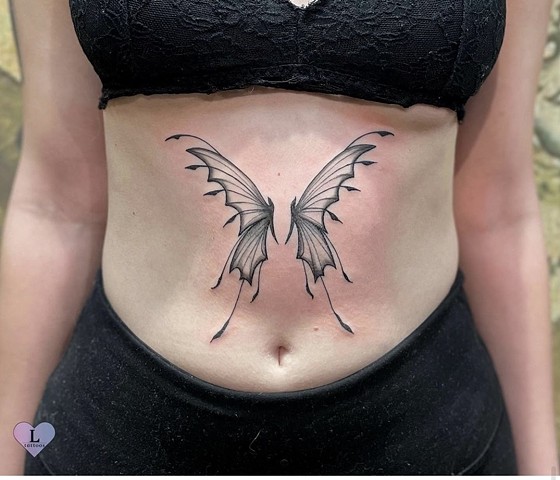 Wings on stomach