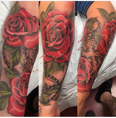 Red Roses and Rosary half sleeve tattoo Strange World Tattoo Calgary 