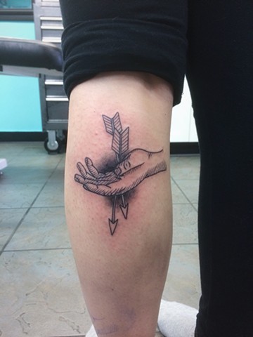 hand and arrow tattoo calgary 