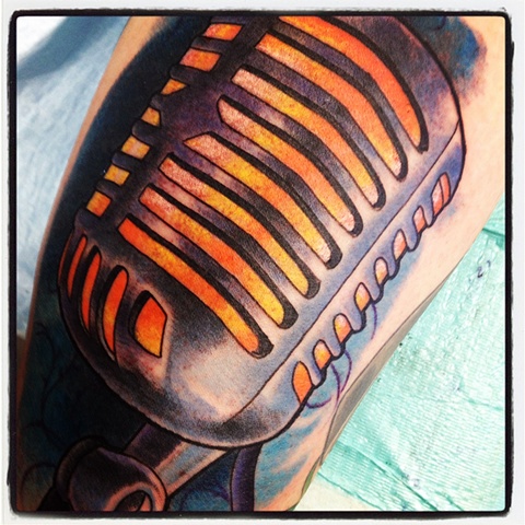 Microphone tattoo in colour by Brett Schwindt of Strange World Tattoo in Calgary, Canada