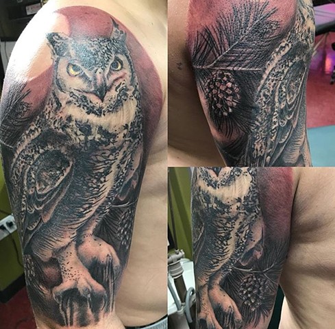 Owl tattoo in black and grey half sleeve tattoo Calgary Canada Strange World Tattoo 