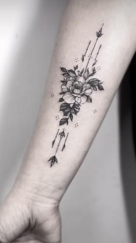flower tattoo in black and grey Strange World Tattoo Calgary Alberta Canada