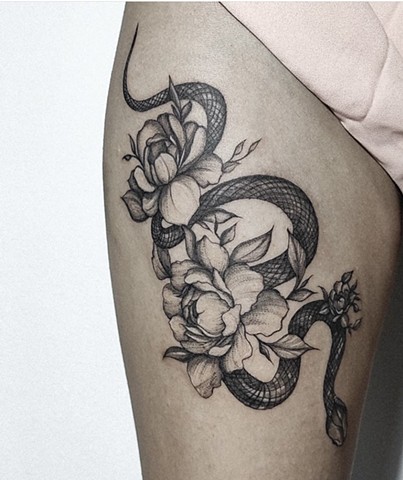 snake tattoo with flowers on upper thigh Calgary tattoos Strange World Tattoo 