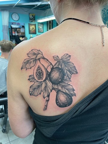 Fig branch and fruit on shoulder blade