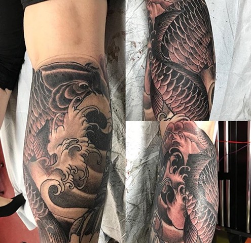 koi fish tattoo in black and grey Strange World Tattoo Calgary Alberta Canada