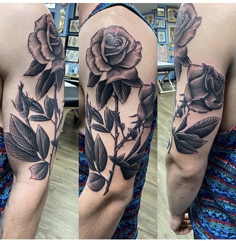 Black and grey tattoo rose tattoo strange world tattoo Calgary Alberta 