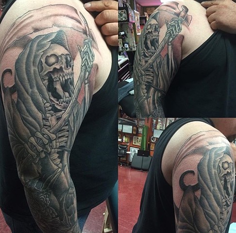 Grim reaper sleeve tattoo in black and grey Strange World Tattoo Calgary, Ab, Canada