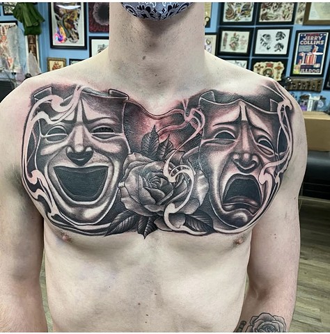 Drama mask tattoo full chest tattoo strange world tattoo Calgary black and grey tattoo 