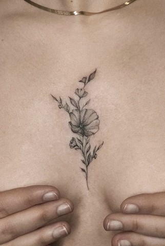 Sternum flower tattoo Calgary Tattoos Strange World Tattoo