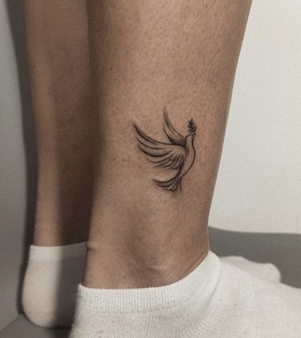 Dove tattoo on the ankle black and grey tattoo Calgary tattoos 