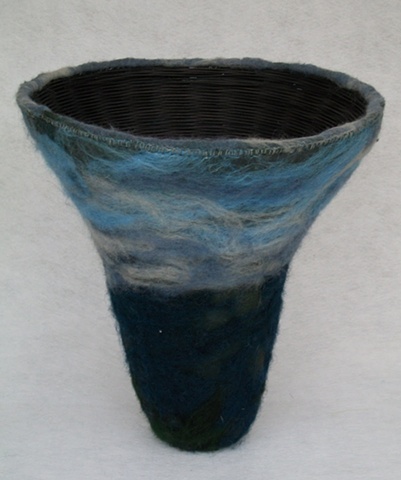 Dyed and woven reed basket with felted wool and silk surface