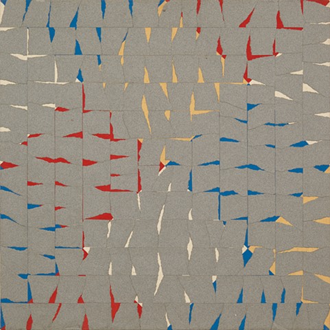 Gray paper fragments over large red, yellow, blue and white painted squares in diamond patterns.