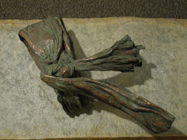 The Shroud, cast bronze sculpture on limestone  