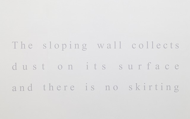The sloping wall collects dust on its surface and there is no skirting 