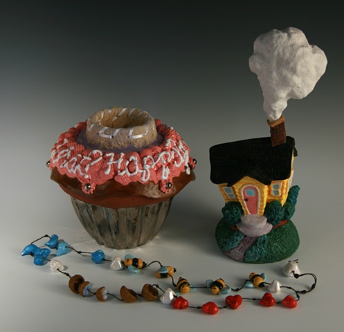 Worry beads are housed inside cupcake.