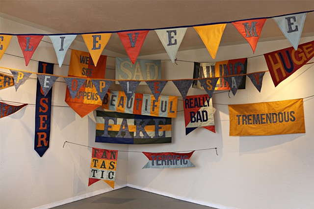 fiber art activist art trump language banners pennants bunting