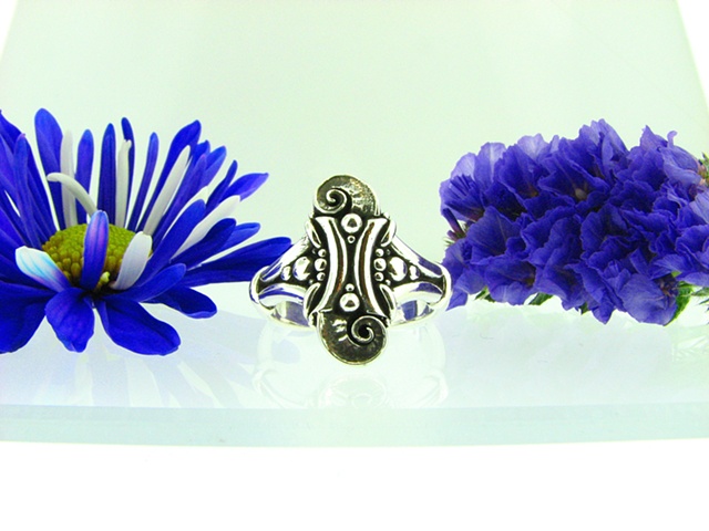 Ornate large sterling silver ring .