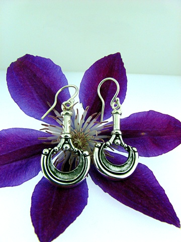 Sterling Silver french hook style ornate casted earrings.